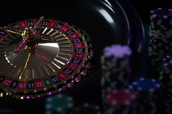 Three Card Poker dealer displaying cards at live studio table